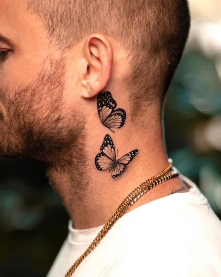 4. A tattoo of two butterflies on a man 