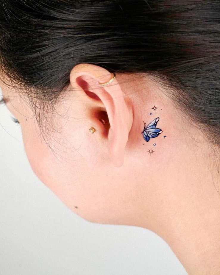 5. A blue butterfly tattoo embellished with sparkles 