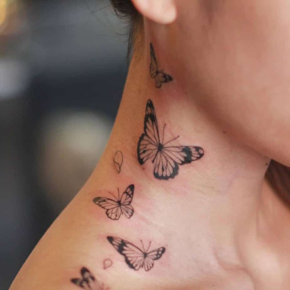 8. A tattoo of butterflies scattered across the neck 