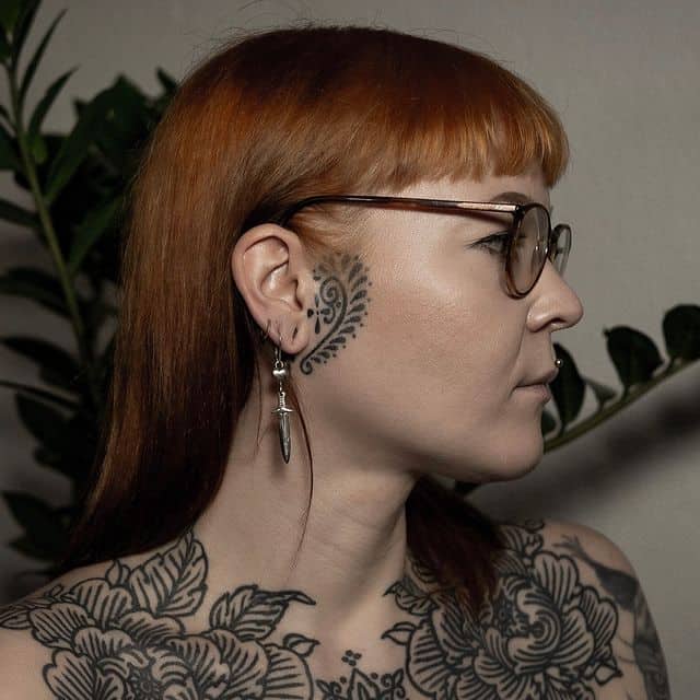 9. Brilliant face tattoo for women