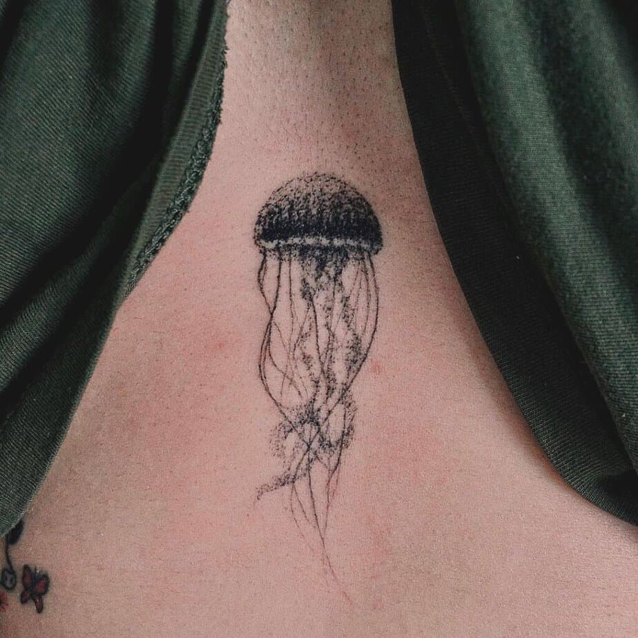 5. A sternum tattoo of a jellyfish