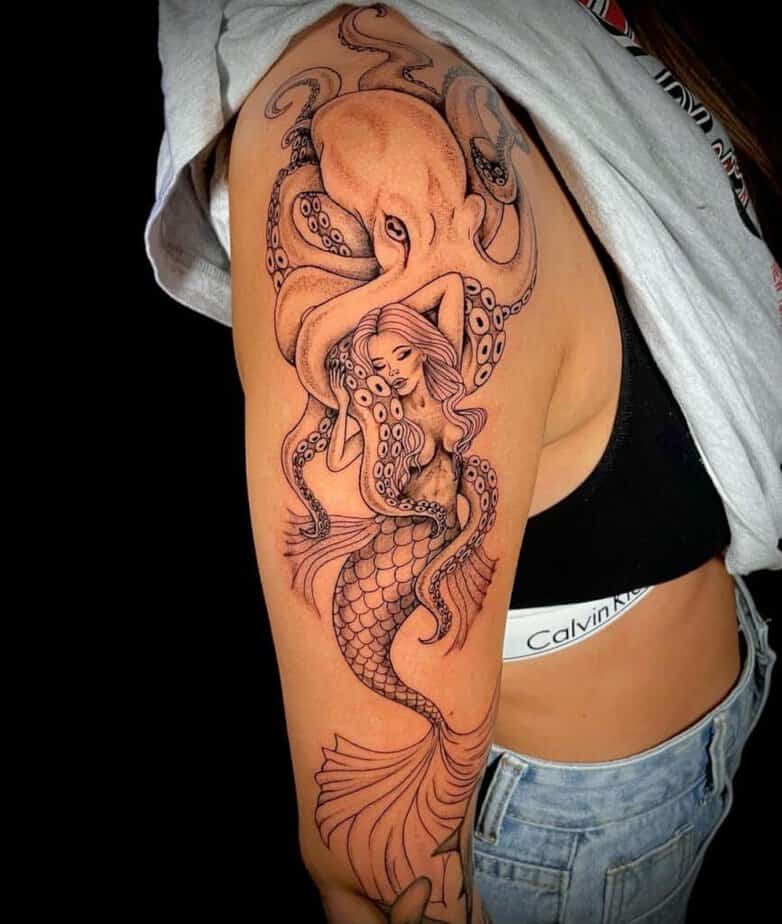 16. A tattoo of a mermaid with an octopus 