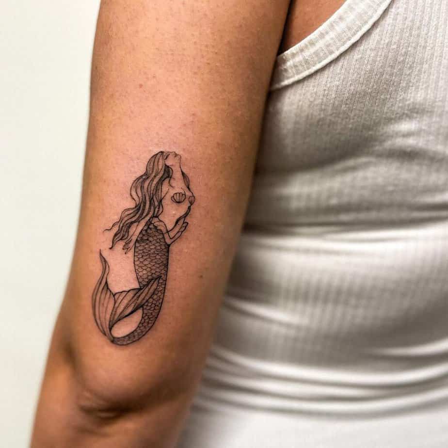 3. A small and simple mermaid tattoo