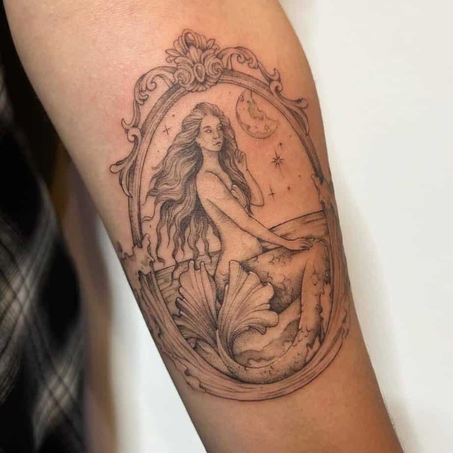 5. A tattoo of a framed mermaid 