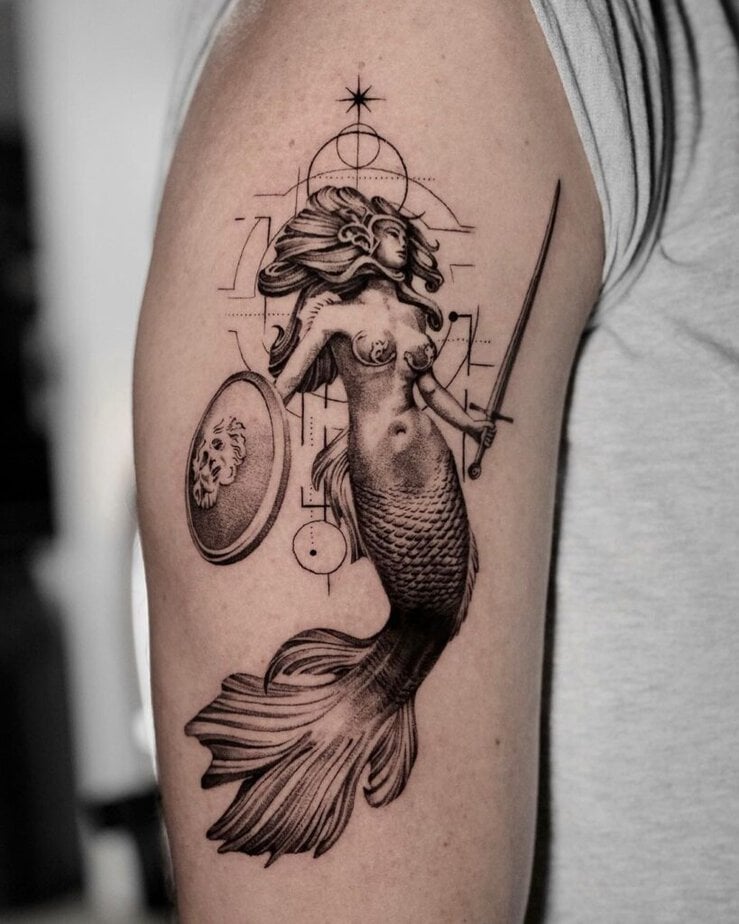 8. A warrior mermaid tattoo 