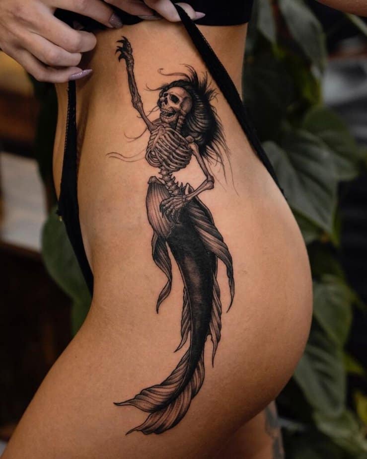 9. A skeleton mermaid tattoo 