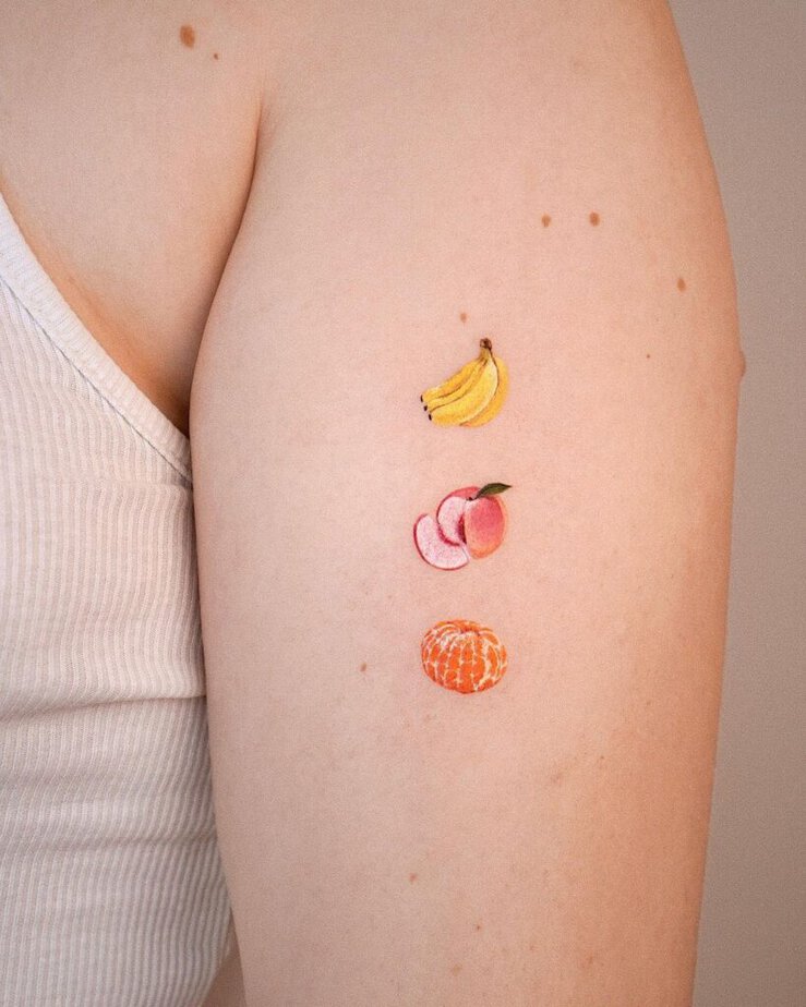 10. A tattoo of bananas, peaches, and mandarin oranges 