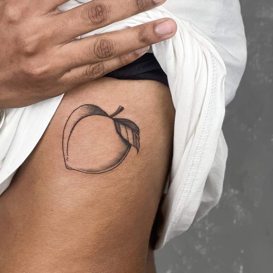 12. A peach tattoo on the ribcage