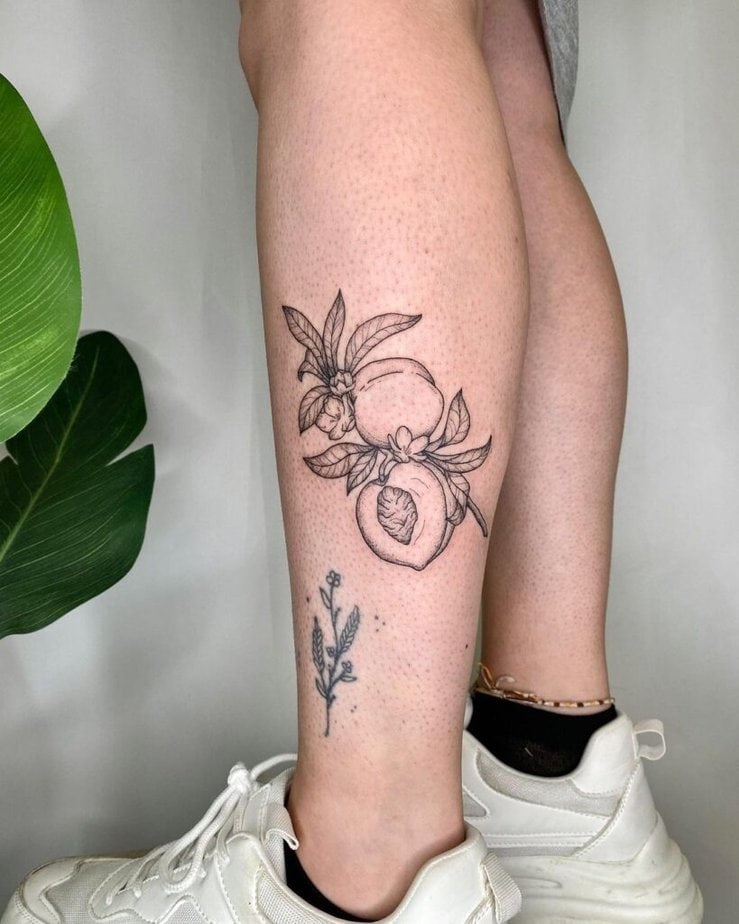 13. A peach tattoo on the leg