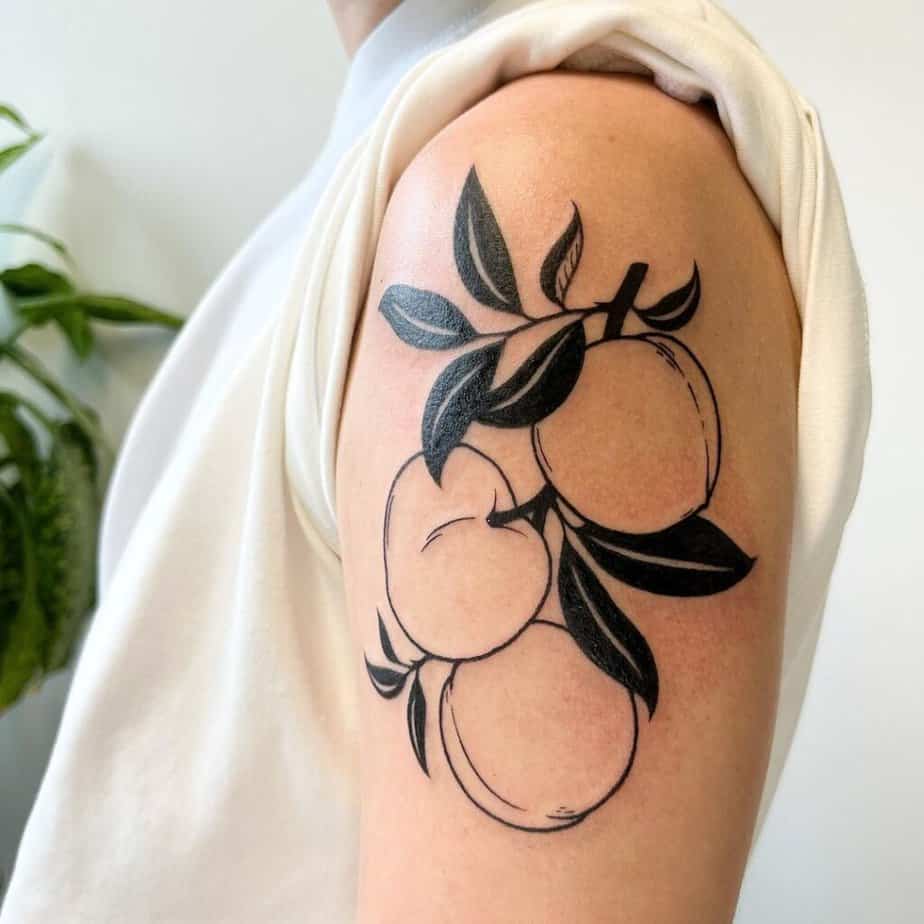 15. A blackwork peach tattoo