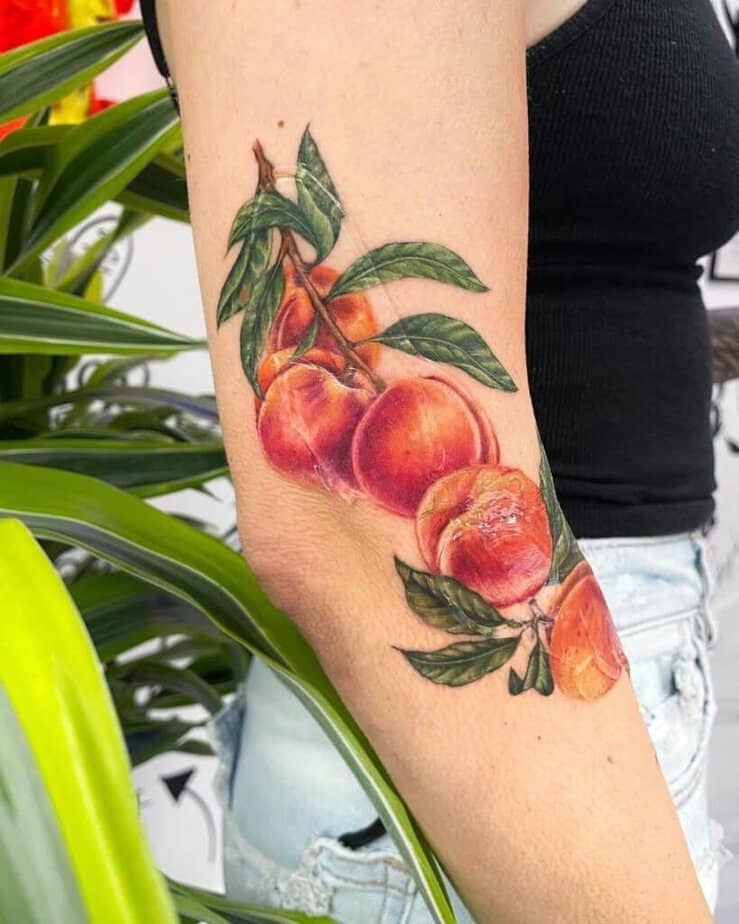 20. A perky peach branch tattoo 