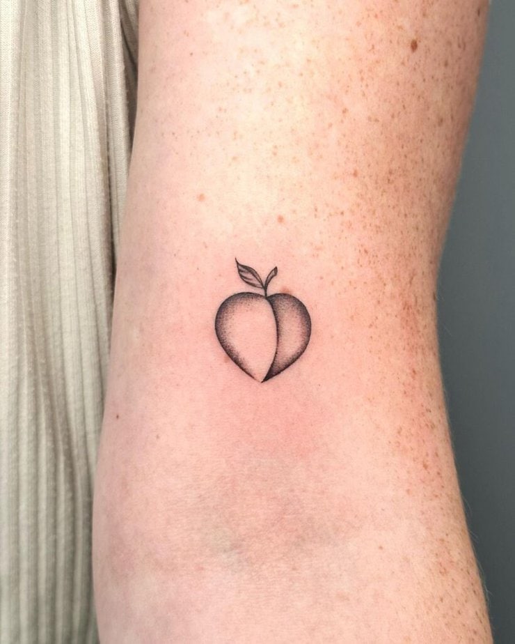 4. A tiny peach tattoo 