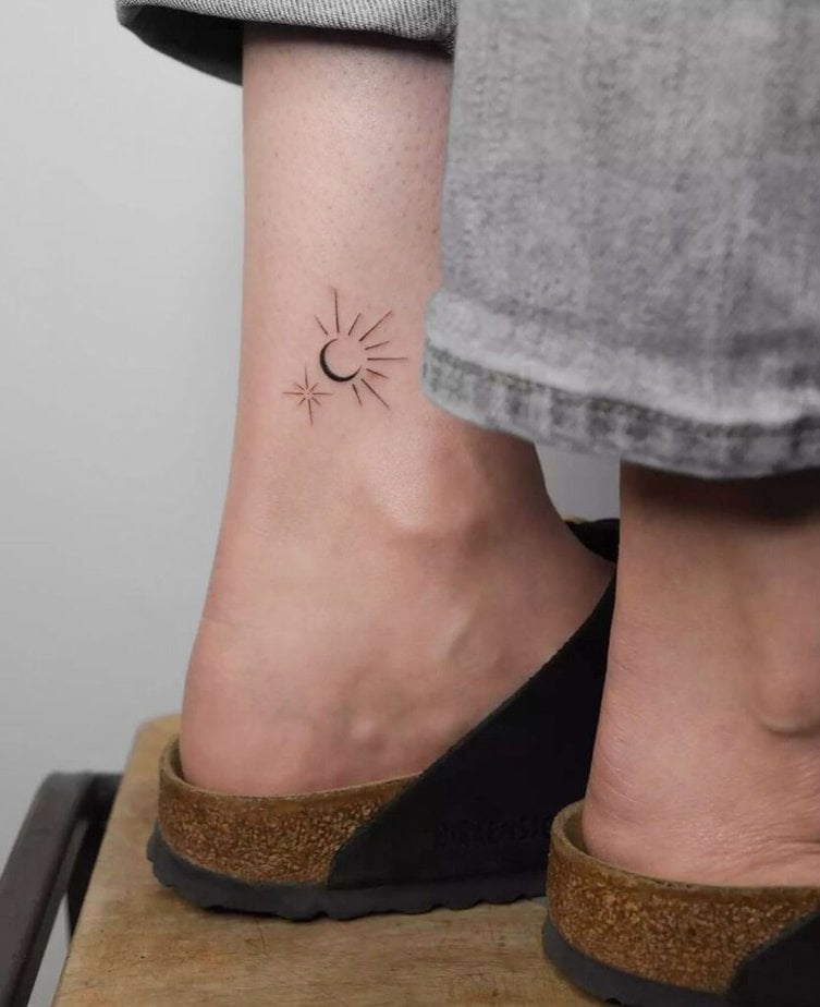 13. A sun and moon ankle tattoo 