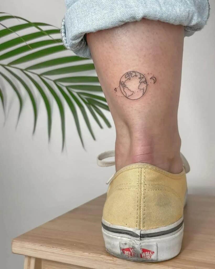 23. A small ankle tattoo of the world 