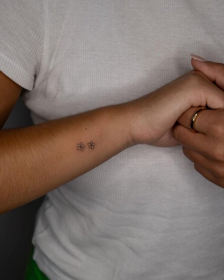 17. A small and simple flower tattoo 