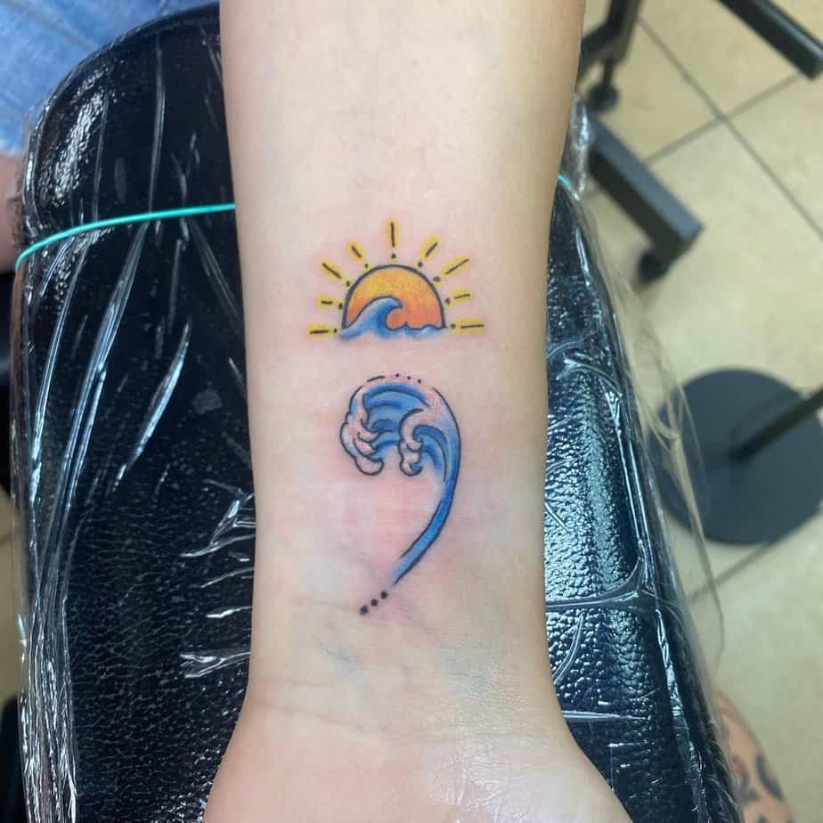 Colorful wave and sun tattoo options

