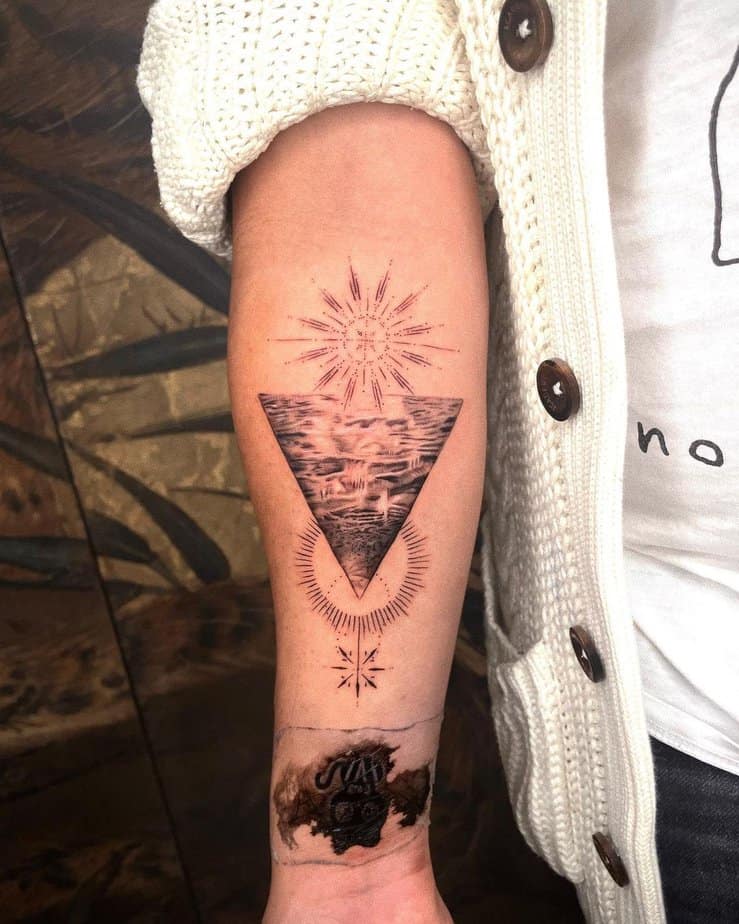 Wave and sun tattoo ideas done with black ink