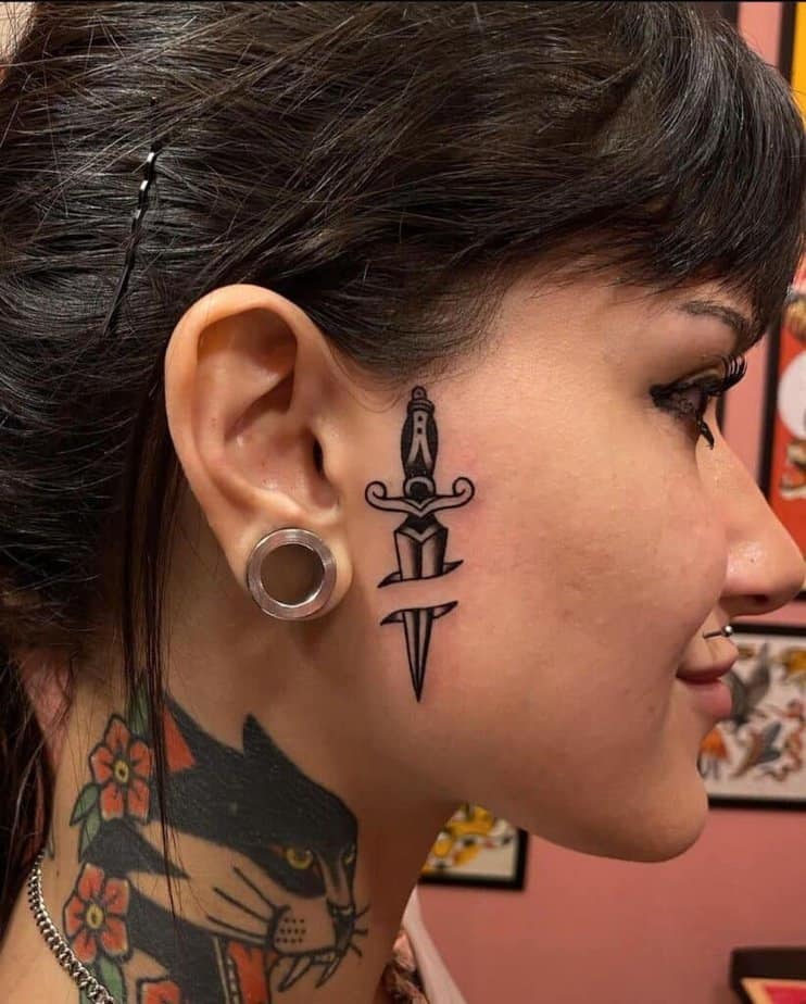 Traditional dagger tattoos
