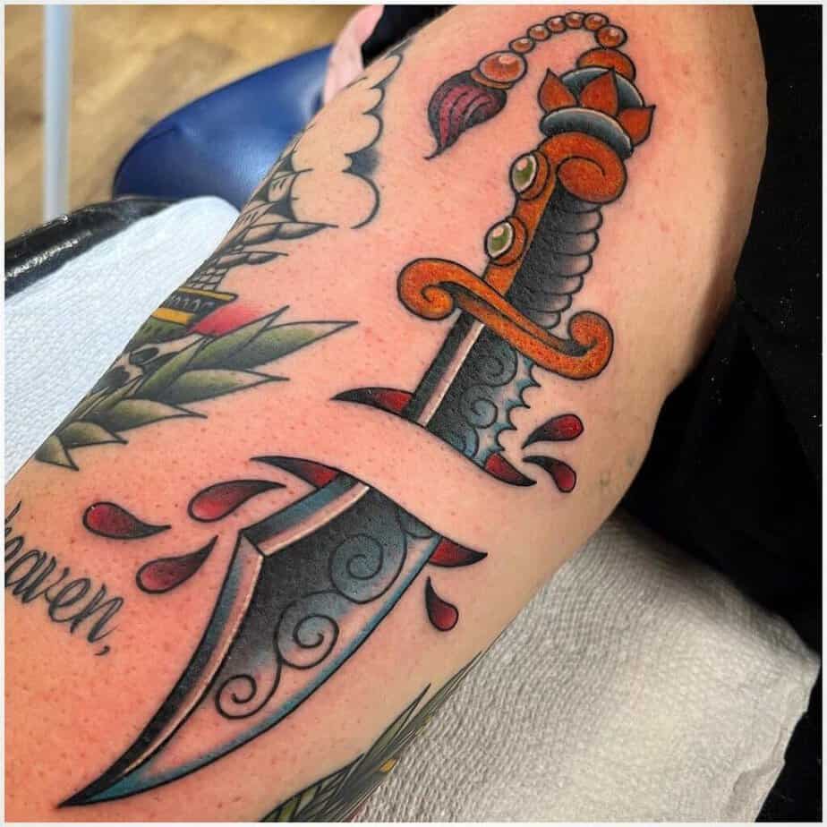 Color traditional dagger tattoos