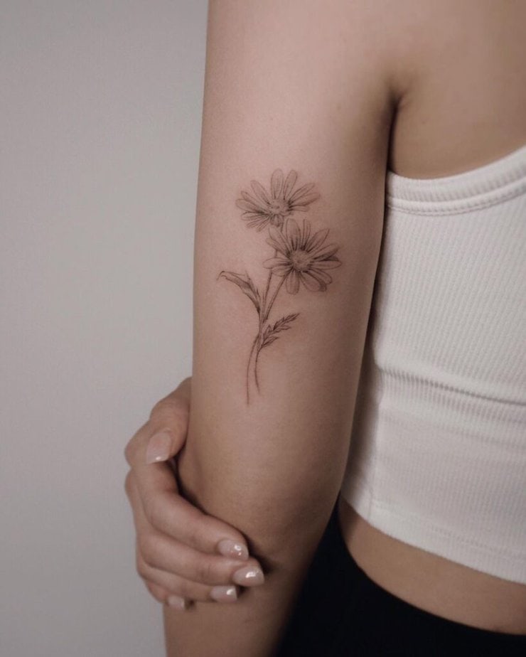 10. A realistic daisy tattoo 