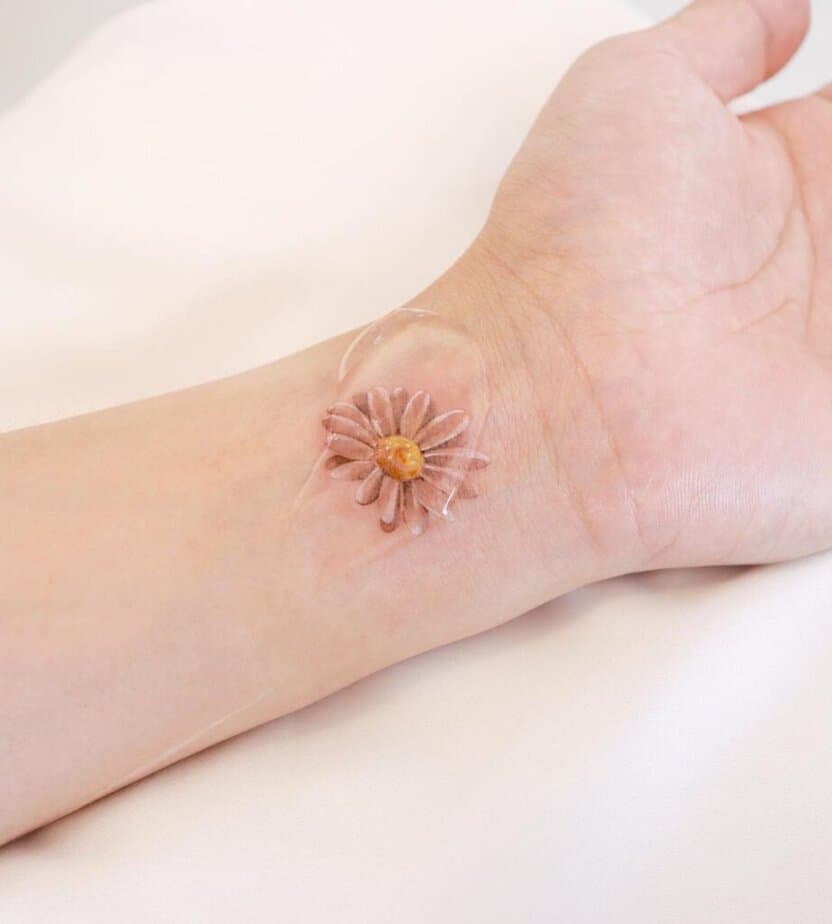 20. A daisy tattoo on the wrist