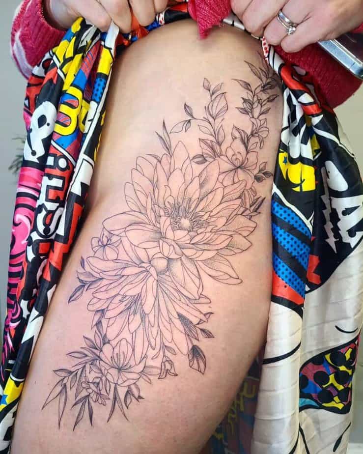 12. A fine-line water lily tattoo on the thigh 