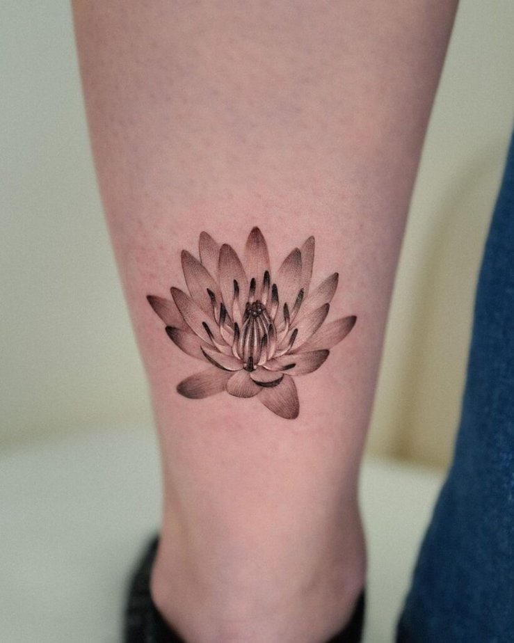 21. A water lily ankle tattoo