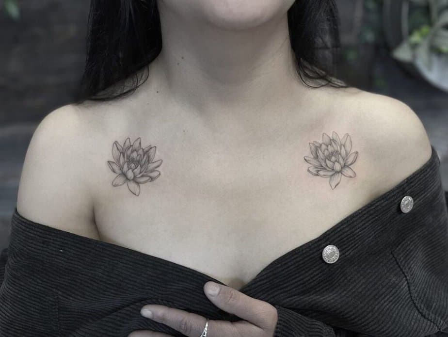22. A symmetrical water lily tattoo on the collarbone