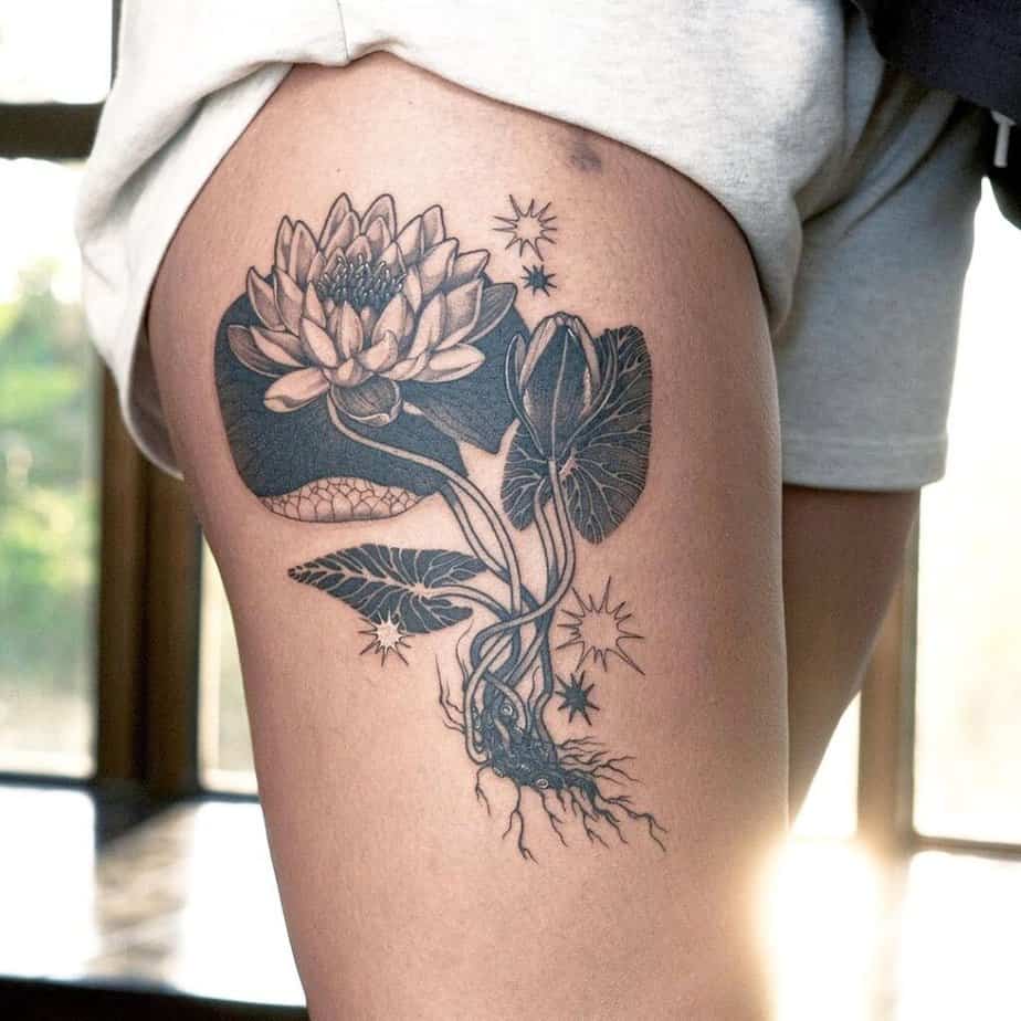 3. A water lily tattoo on the thigh