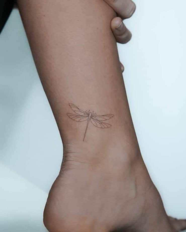 25. A tattoo of a delicate dragonfly on the ankle 