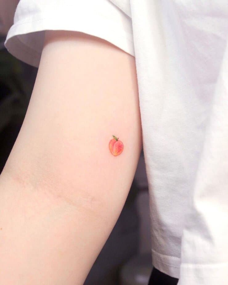 15. A tiny peach tattoo on the bicep