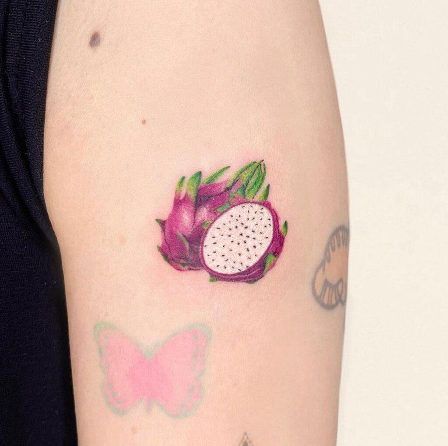 6. A dragon fruit tattoo on the upper arm
