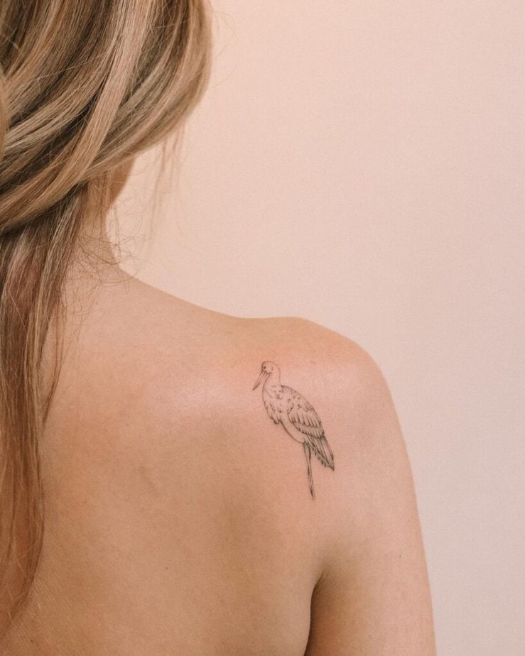 10. A bird tattoo on the back of the shoulder 