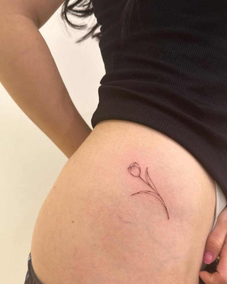 13. A tulip tattoo on the hip