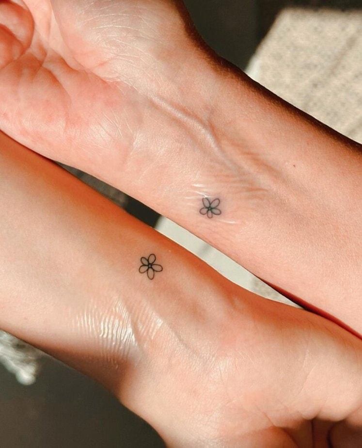 20. A matching flower tattoo on the wrist 