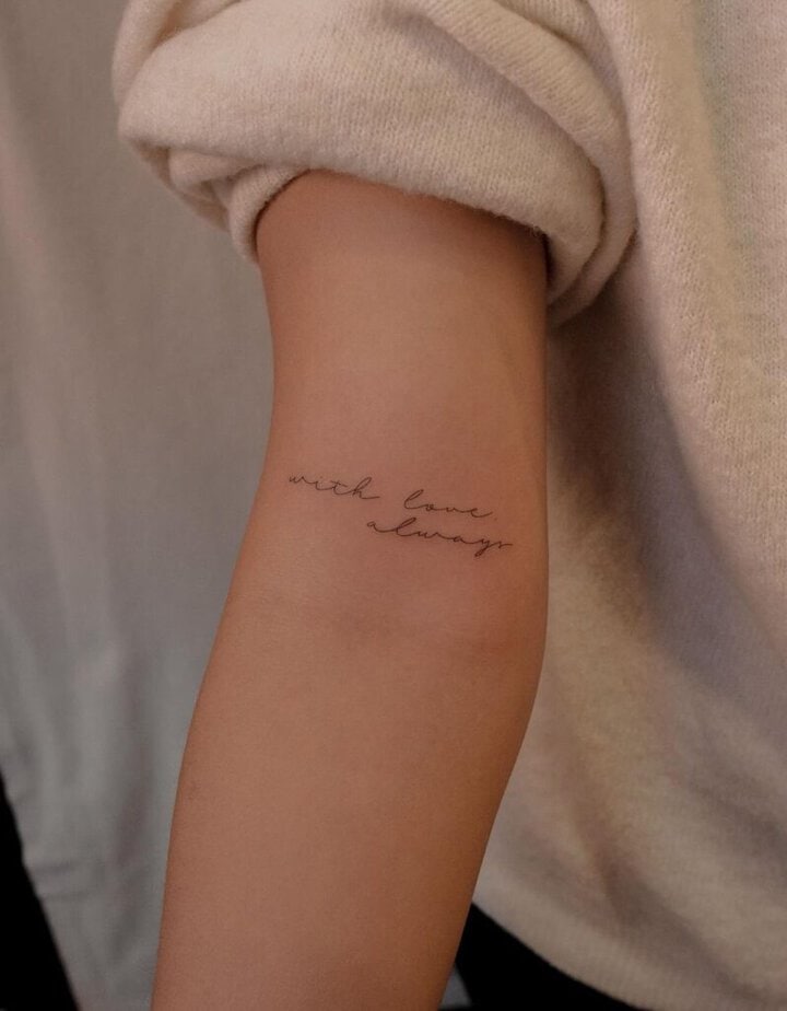 6. An intricate script tattoo on the inside of the arm