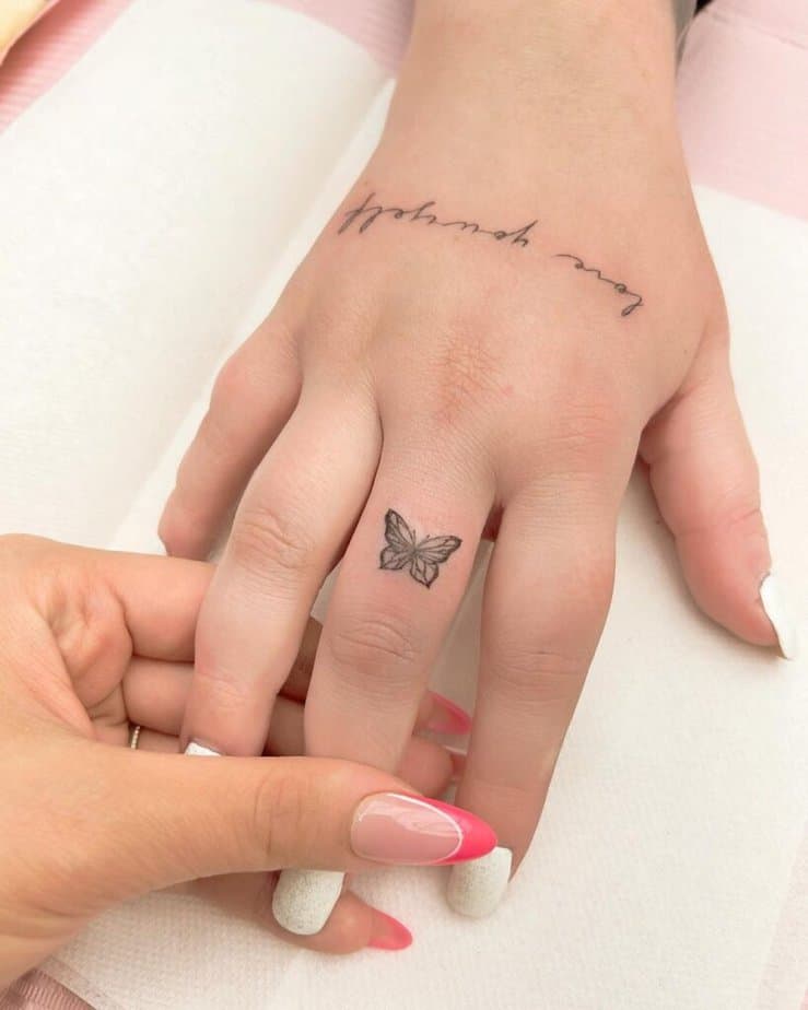17. A simple butterfly finger tattoo 