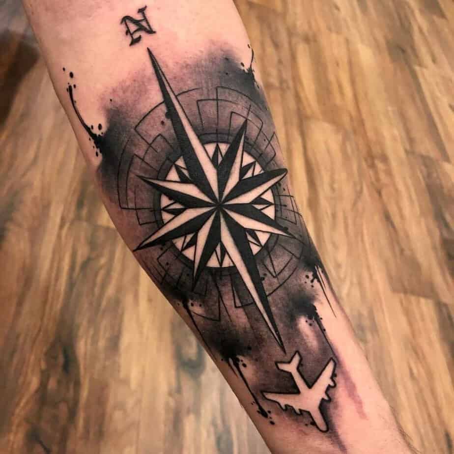 Compass and plane tattoo
