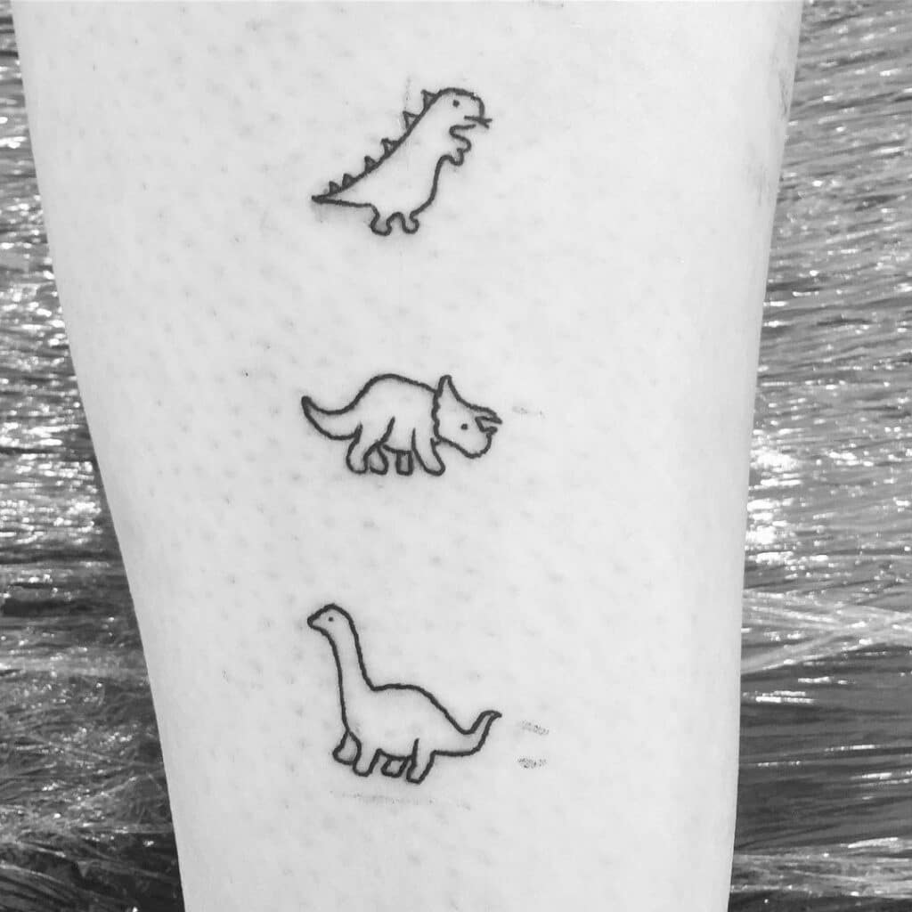 Multiple dinosaur tattoos