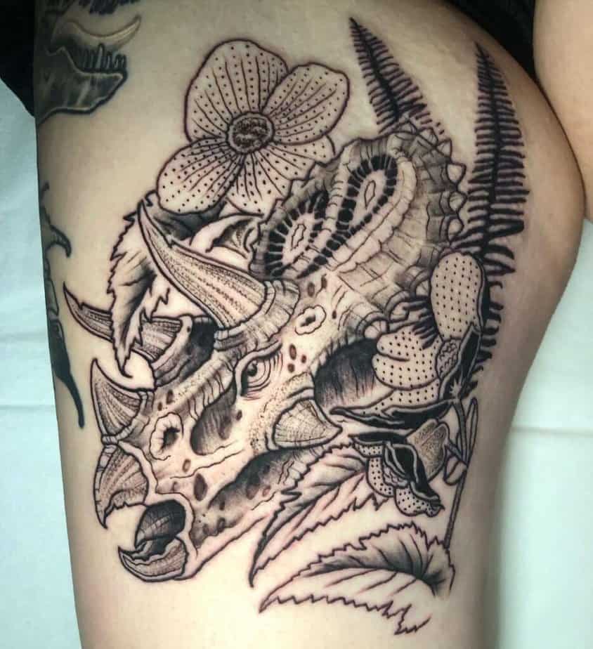 Floral dinosaur tattoos