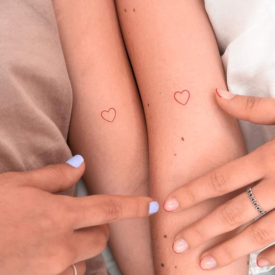 15. A matching tattoo of little hearts in red ink 