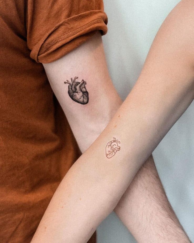 17. Matching tattoos of anatomical hearts 