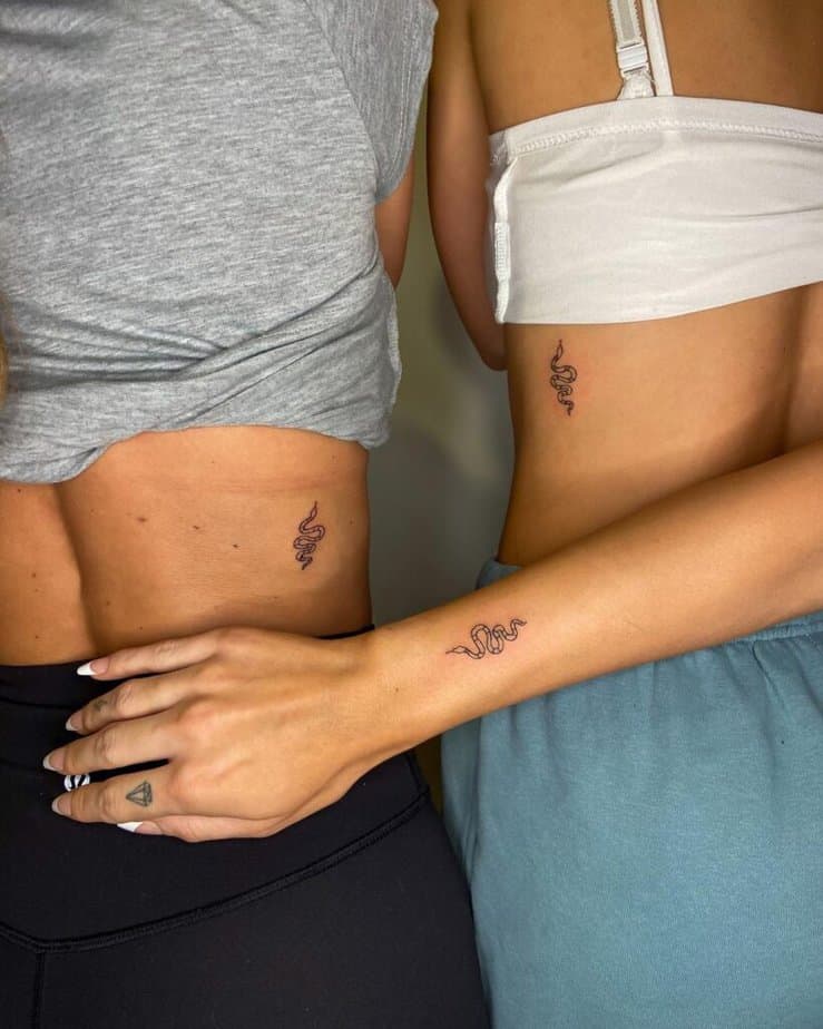 21. Matching tattoos of snakes 