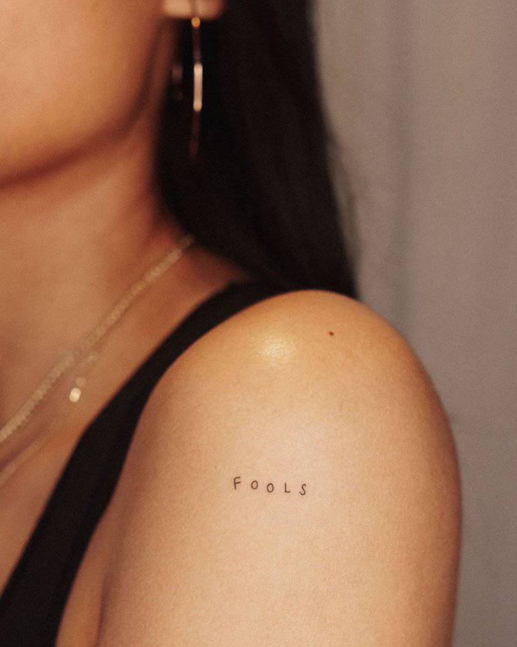 12. A “fools” tattoo on the shoulder