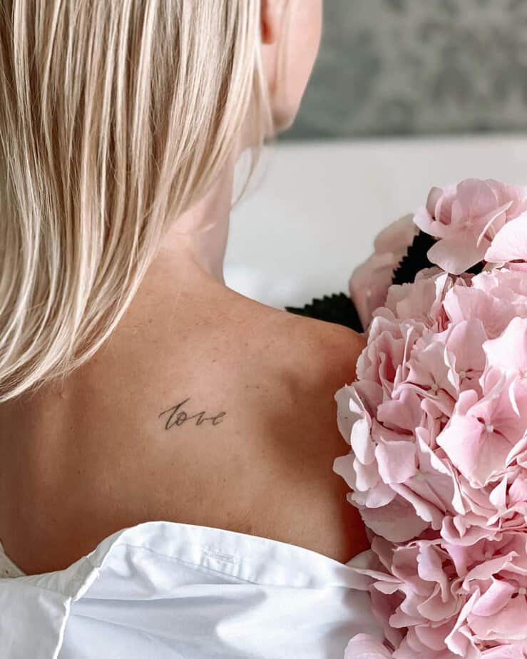 24. A “love” tattoo on the shoulder