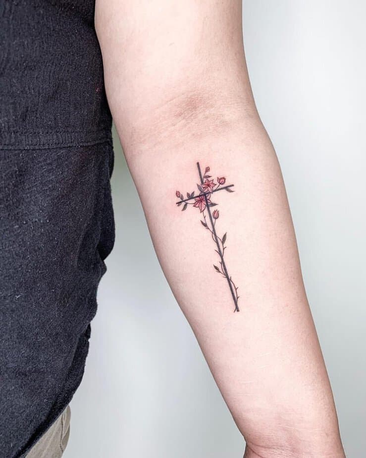 A simple cross tattoo on your arm