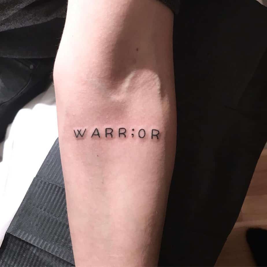 Semicolon tattoo with text