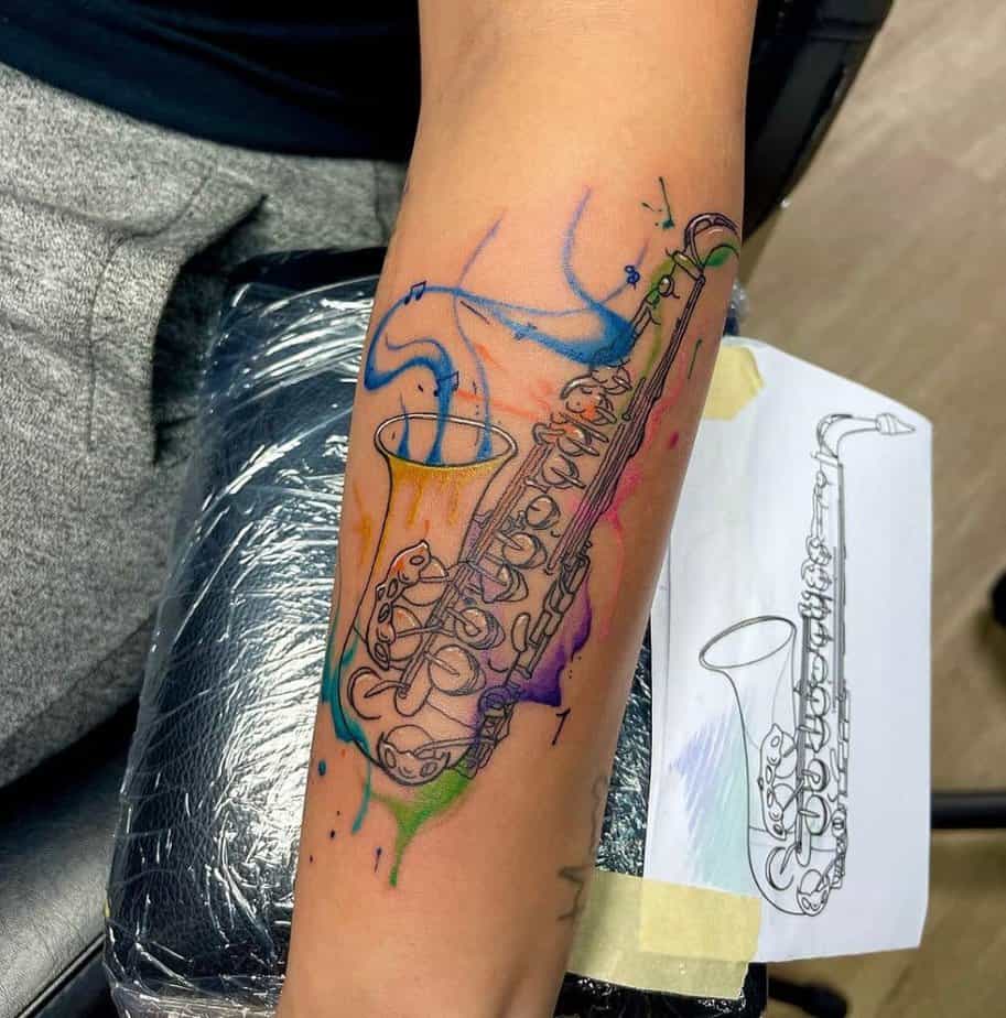 10. A sax tattoo with colored details 