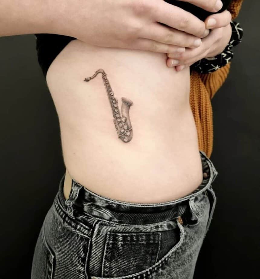 12. A saxophone ribcage tattoo 
