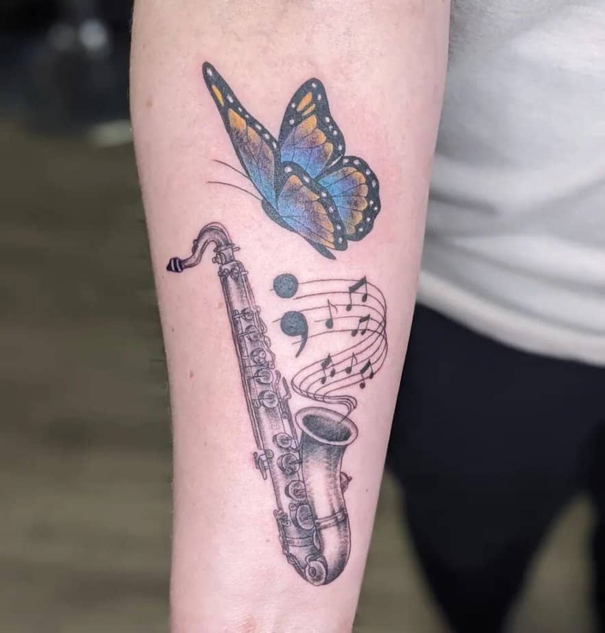 18. A sax tattoo with a semicolon 